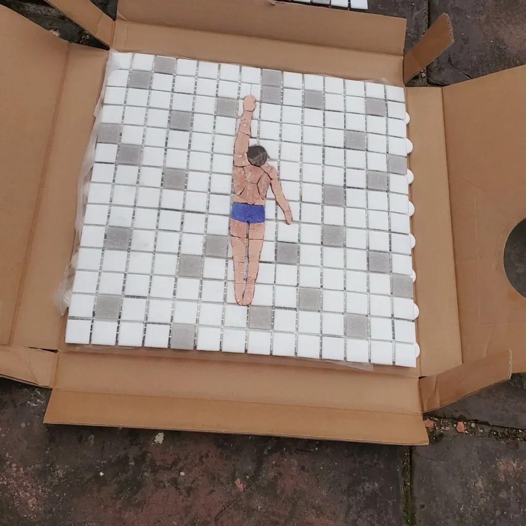 Art Deco mosaic tile pattern mid-installation reveal at 30 seconds