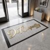 Branded logo mosaic entrance mat installed at a business entrance
